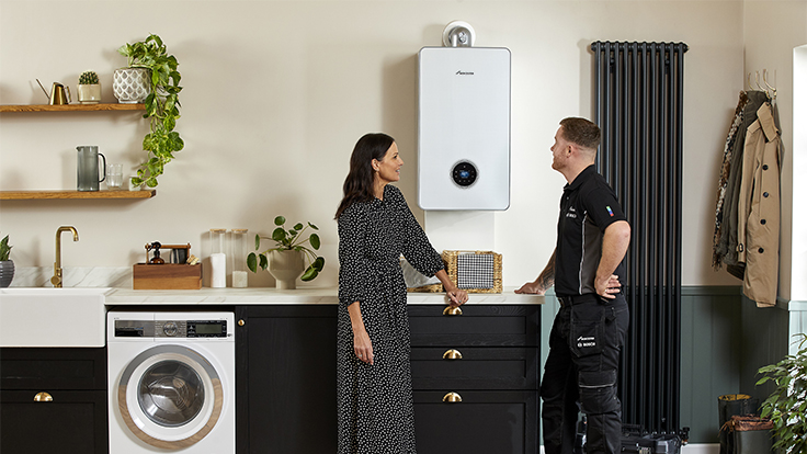 Installer repairing boiler